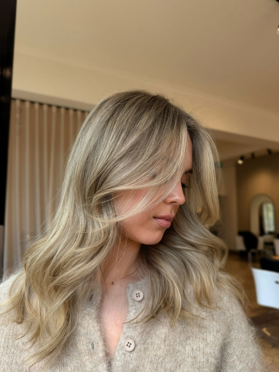Lived-in blonde with soft dimension and seamless blending, created by blonde specialists at Vision Hair Studio in South Melbourne, Melbourne.